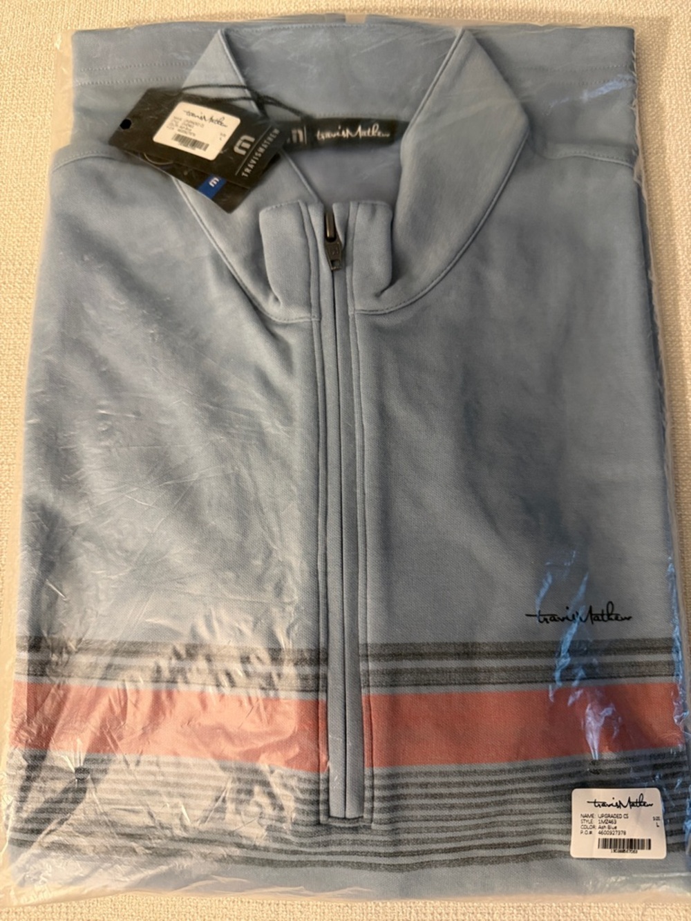 NWT TravisMathew Light Blue Quarter-Zip with Coral Stripe